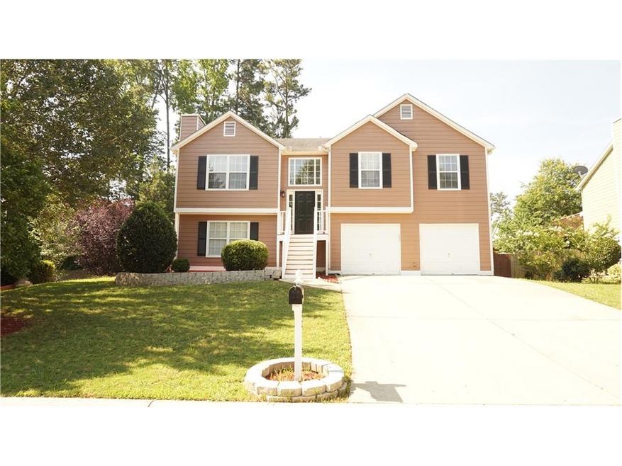 Front view of the house in a culdesac. large home 