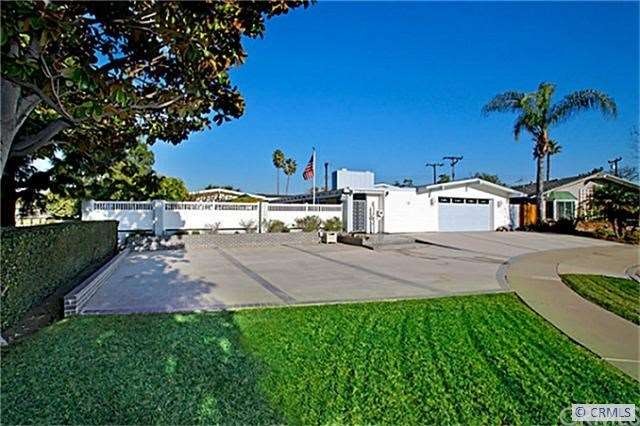 Front Showing large driveway and RV/Boat area with