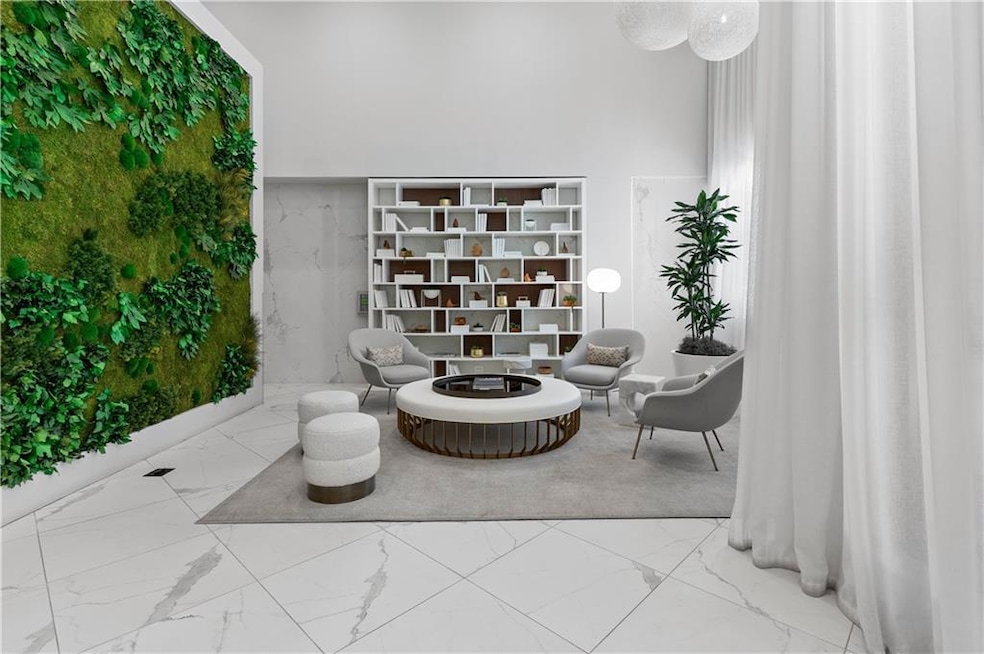 Living area with marble look tiles and a high ceiling