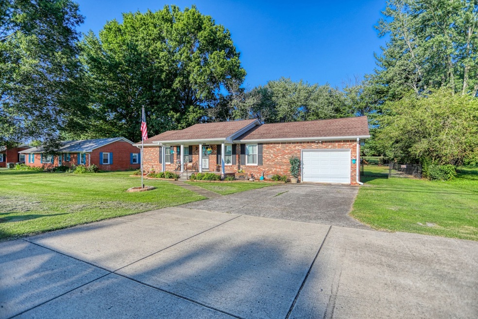 Concreate dr with added parking space.