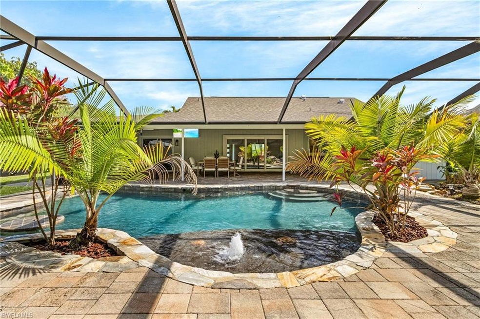 View of pool featuring a lanai, a fenced backyard, a patio, and pool