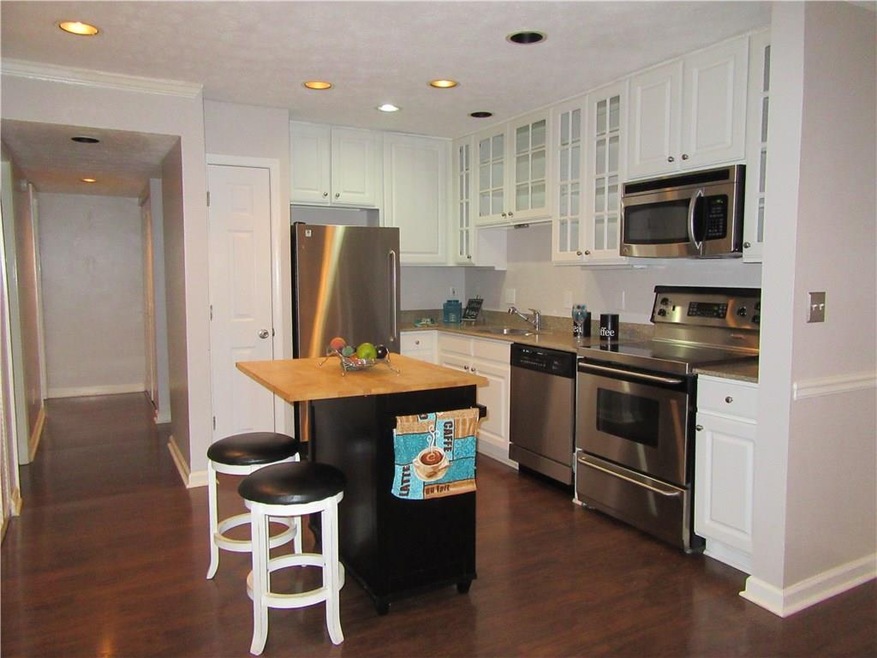 Gorgeous kitchen features White cabinets, SS appli