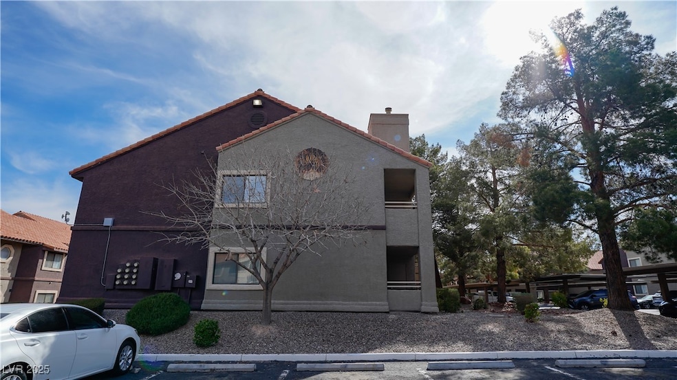 View of front of home with uncovered parking, a ch