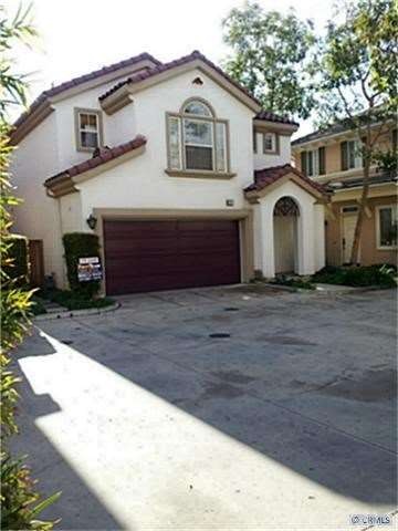 Front of Home in Courtyard Setting