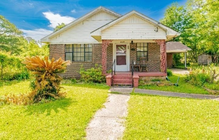 Bungalow-style home featuring covered porch and a 