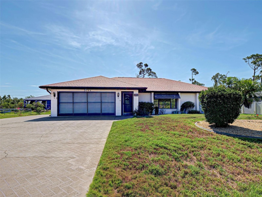 Beautiful Florida home on an oversized lot.  Includes screen doors on the garage.