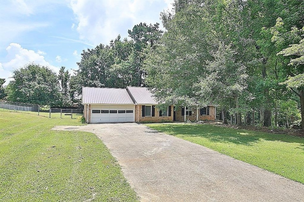 View of front of property featuring a garage and a