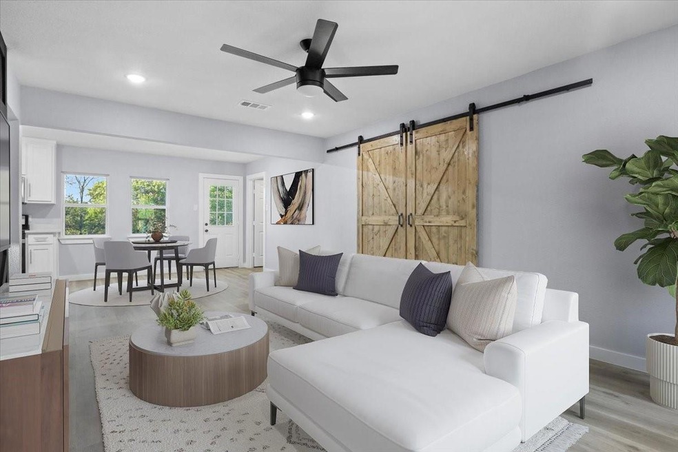 Living room featuring visible vents, recessed ligh