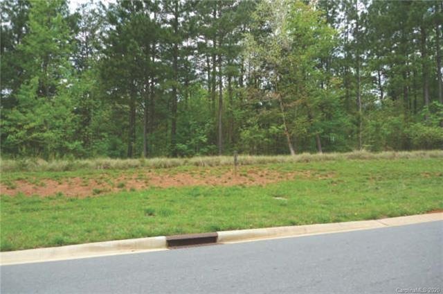 Wooded home site in Reflection Pointe, a gated com