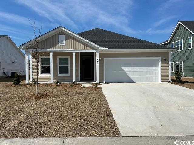 View of front of house featuring roof with shingle