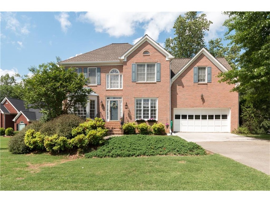 Well maintained brick 4 bedroom home on large leve