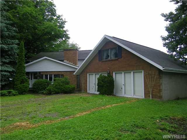 Exterior Front Brick and vinyl home with 2+ car ga