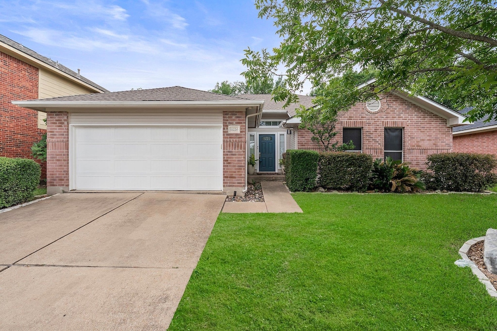 View of front facade featuring concrete driveway,