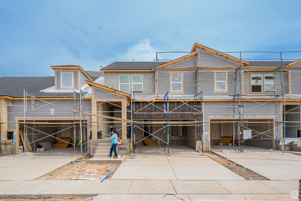 Property in mid-construction with roof with shingles