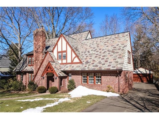 Elegant brick and stucco Tudor on quiet Spring Gle