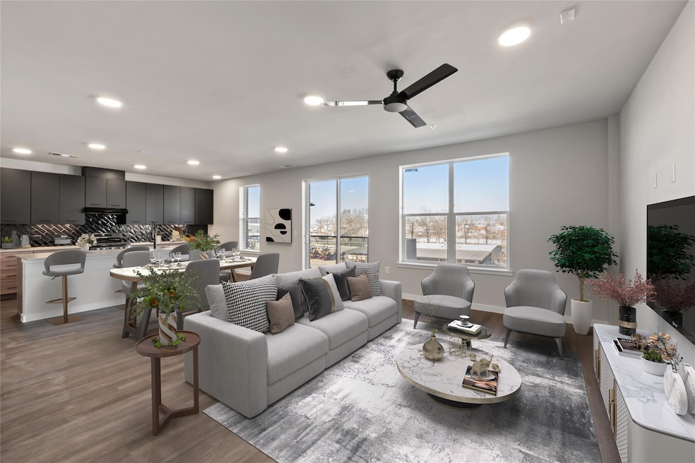 Living area with wood finished floors, recessed l