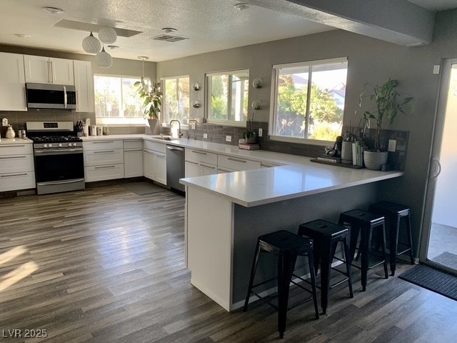 Kitchen featuring appliances with stainless steel