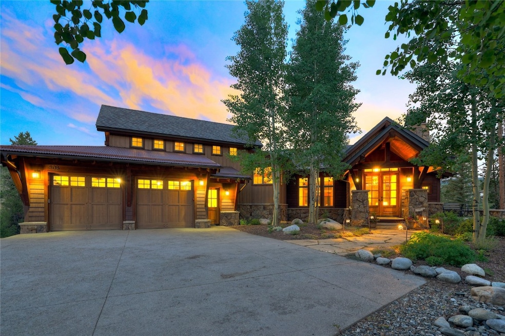 View of front of home with stone siding, concrete