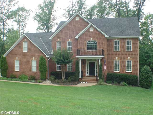 Exterior Front - 3-sided brick, huge full 3 car ga