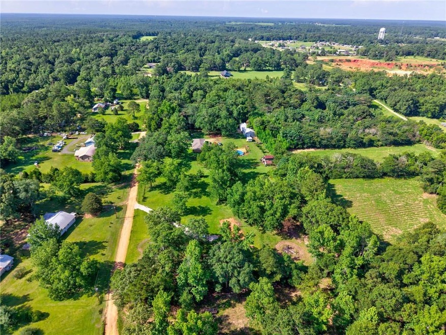 Aerial overview of property's location with a forest