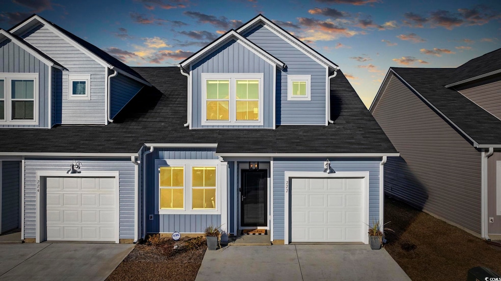 View of front facade featuring a garage