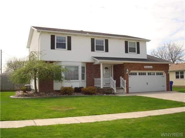 Exterior Front Brick and vinyl sided colonial with