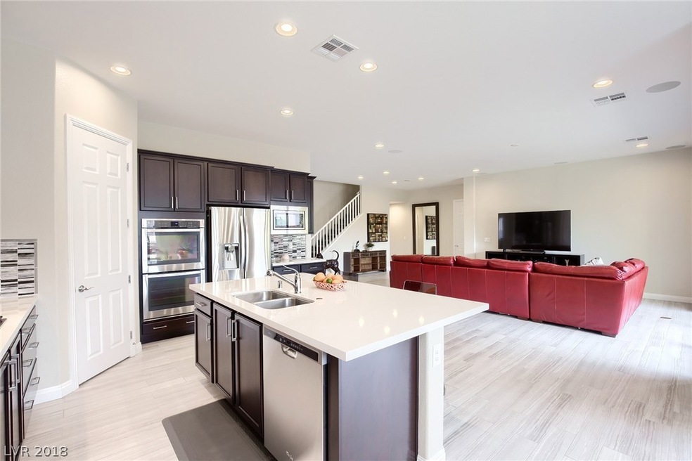 Upgraded kitchen with quartz counter tops and porc
