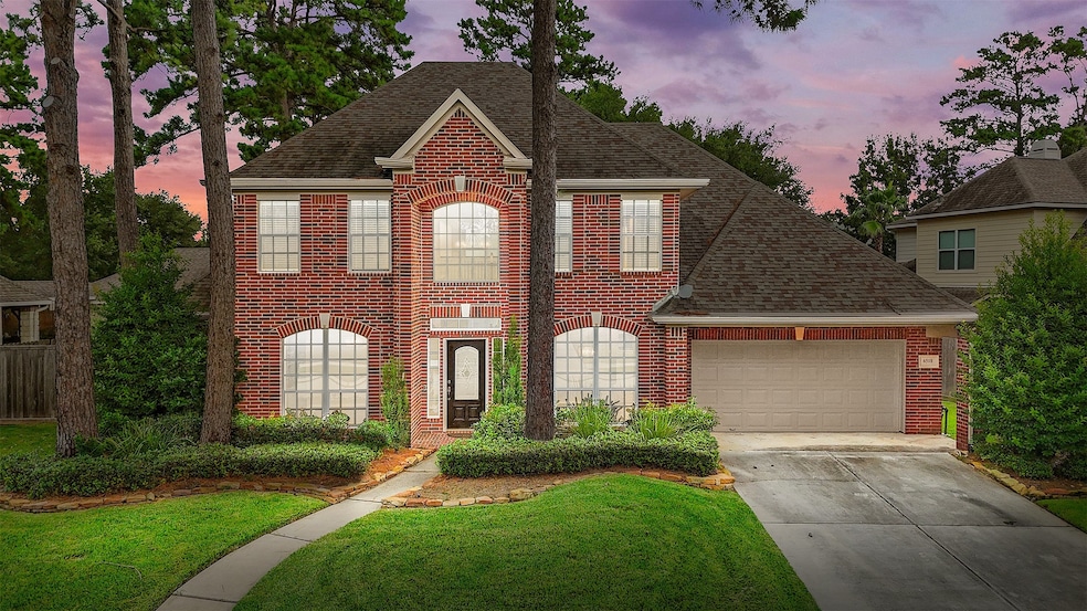 This lovely two-story brick home greets you with a