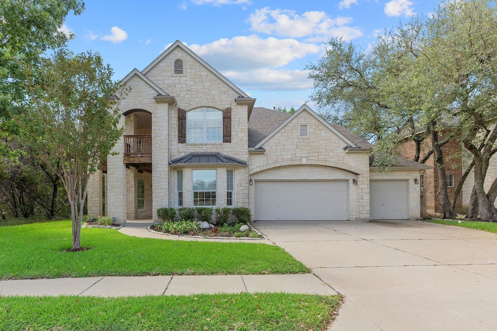 French country home with a front yard, concrete d