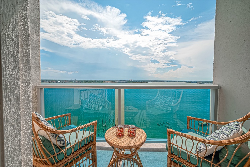 Private balcony with glass railing looking towards