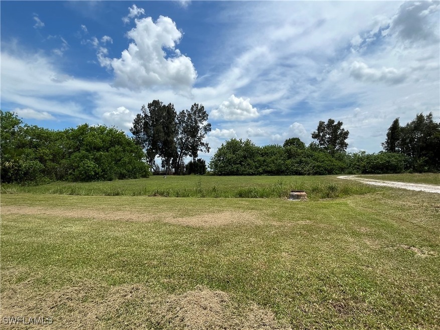 View of yard with a rural view