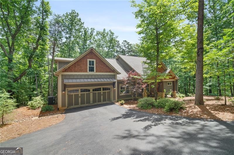 Craftsman-style house with a standing seam roof, a
