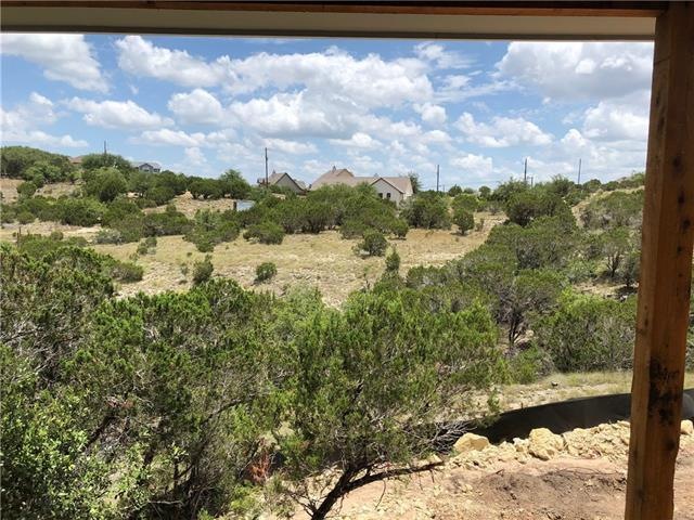 View from back patio door - house is on almost an acre! Imagine sitting out on your back deck watching the deer and other wildlife! Tongue and groove ceilings give the deck area a warm and inviting feel - you and your guests can enjoy the view and tr