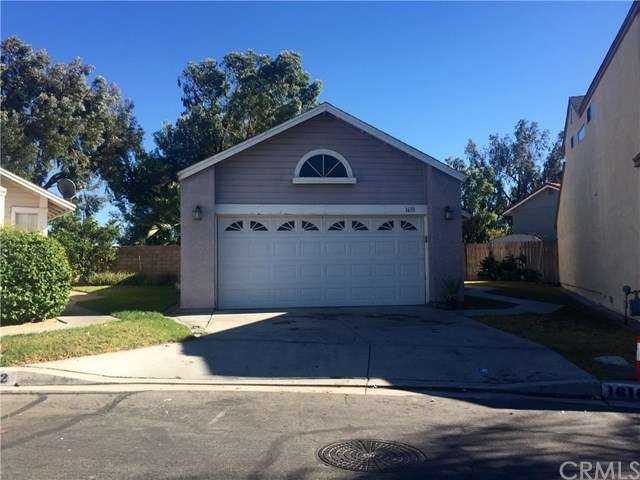 2 car garage attached with laundry hookups inside