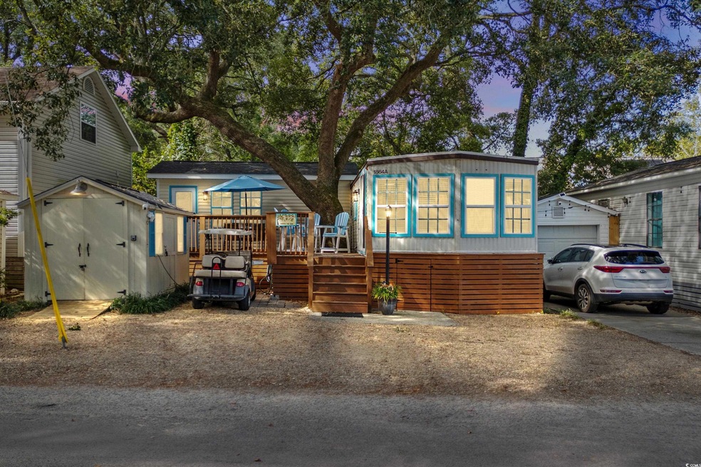 View of front of property with an outbuilding and 