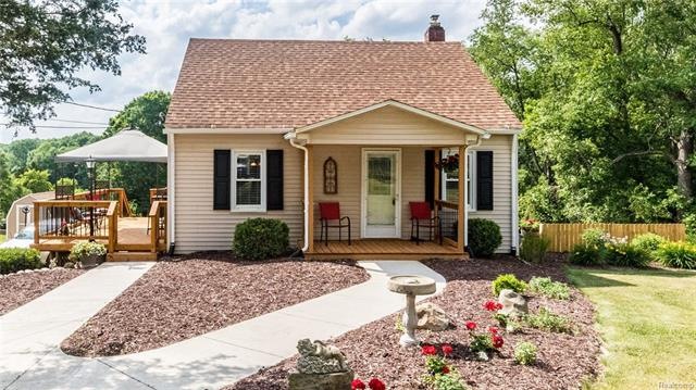 Style and Charm on over an acre!