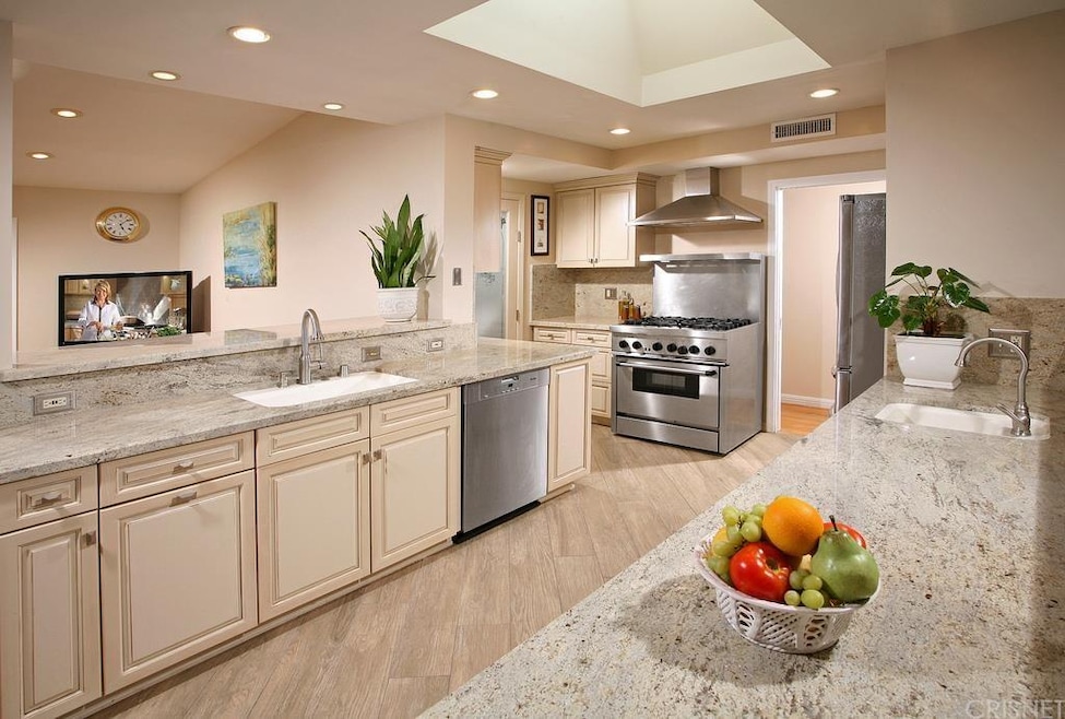 The chef in the family is going to truly appreciate the remodeled gourmet kitchens recessed lighting, low-e skylight, abundant custom cabinets, large walk-in pantry, granite counters with full backsplash, under mount state-of-the-art single bowl/Farm