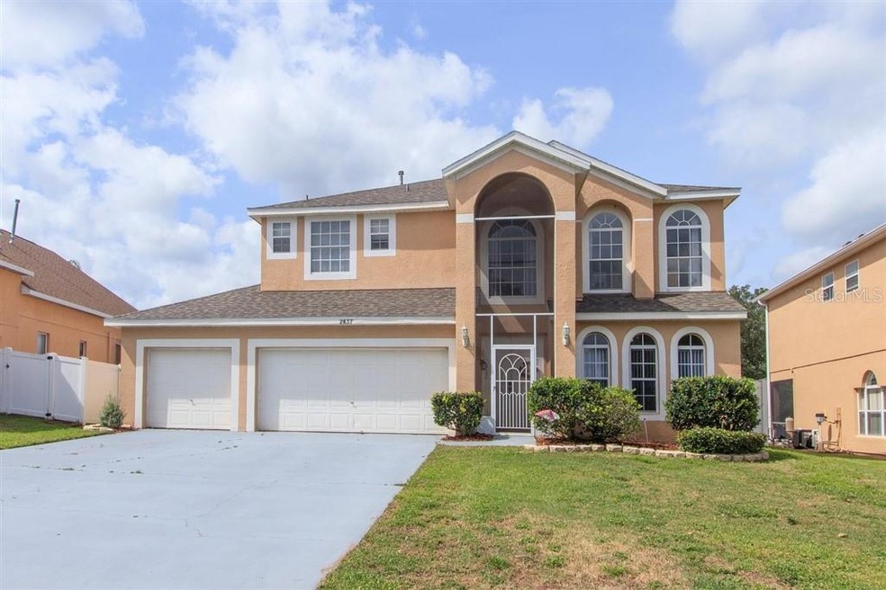 Exterior front facade w/3 car garage, screen enclo