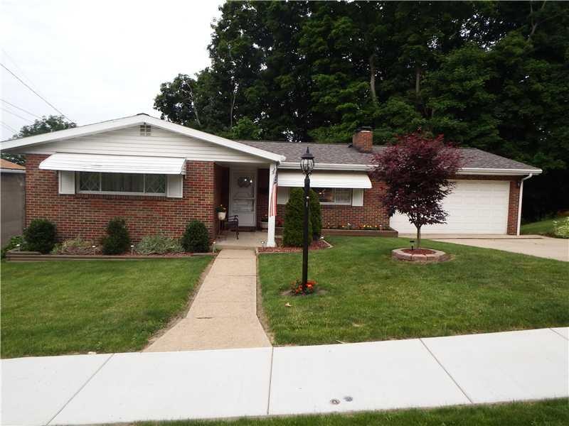 Exterior Front. Brick exterior, well landscaped, o