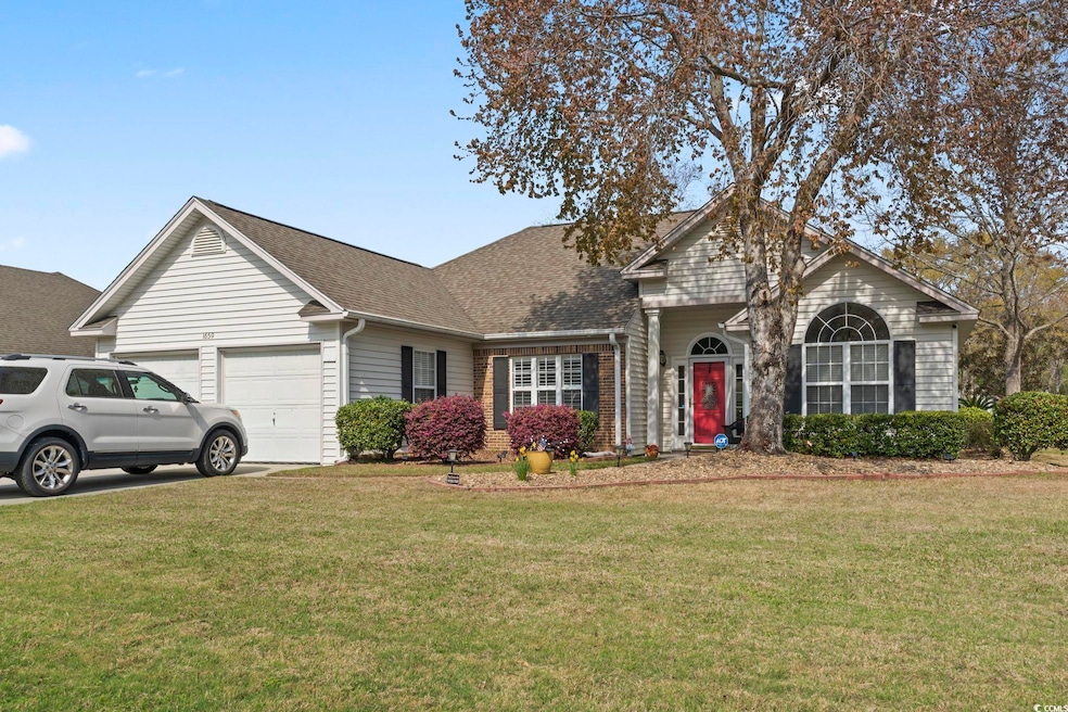 Traditional-style house with driveway, a front law