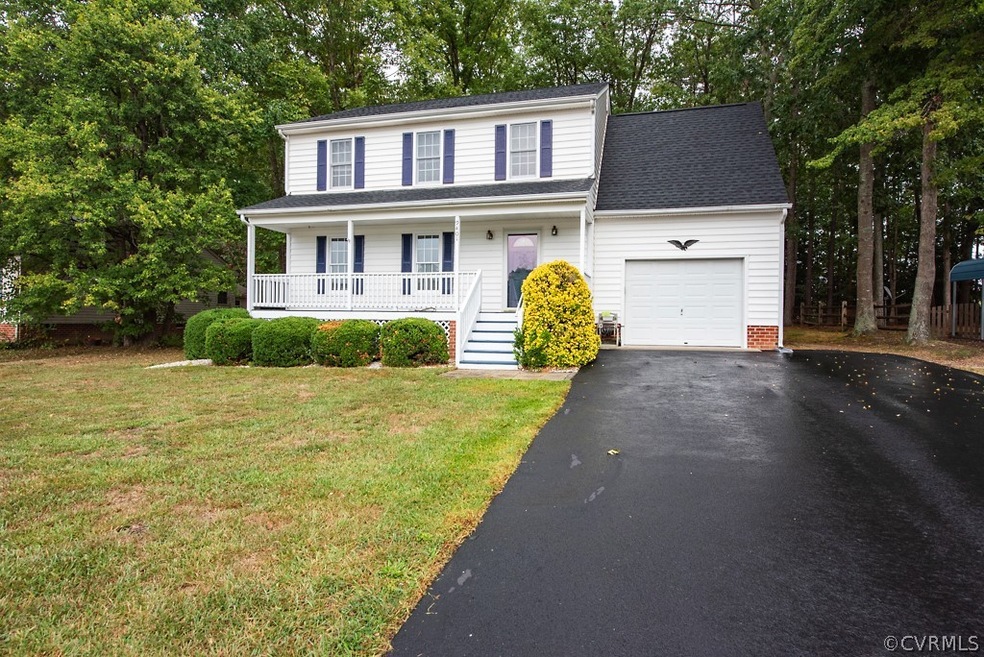 Front view of home with newly paved driveway