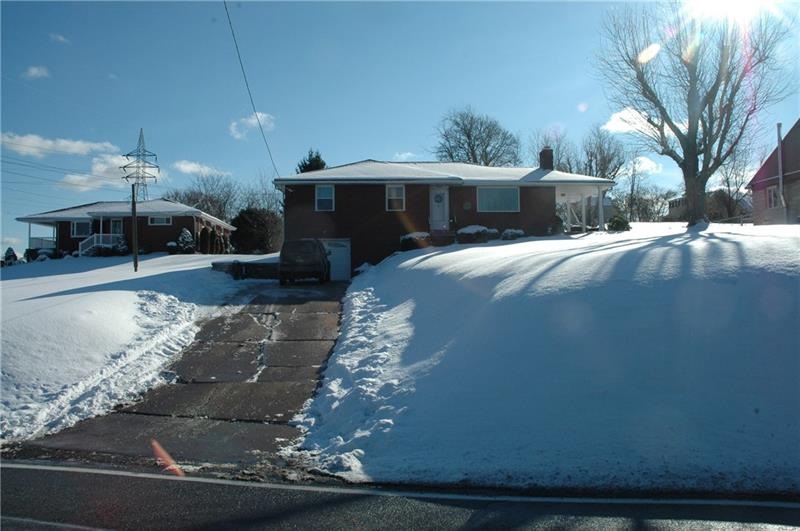 The driveway has an additional area for turning ar