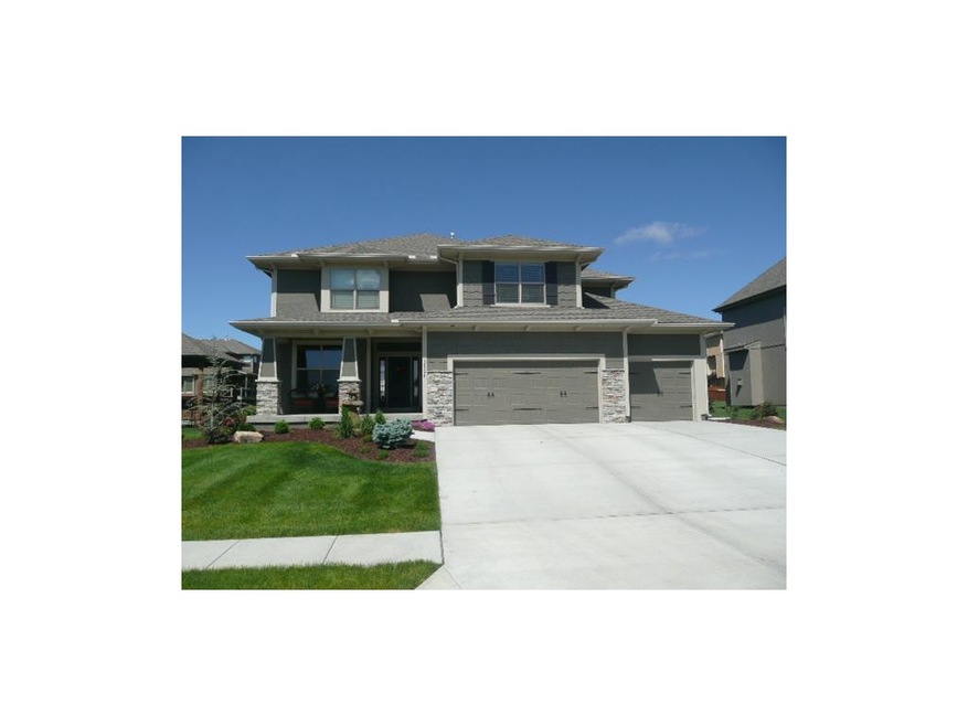 Front elevation.  Notice 3 full driveway lanes for