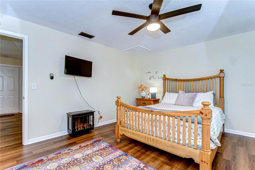 The bedroom features a comfortable queen size bed