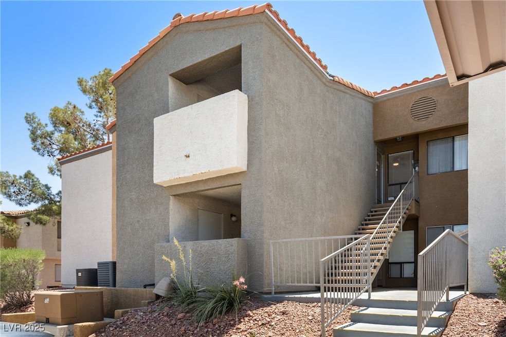 View of front of house featuring stucco siding, st