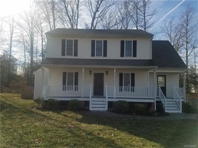 House features country porch, 2 doors to enter, 1 