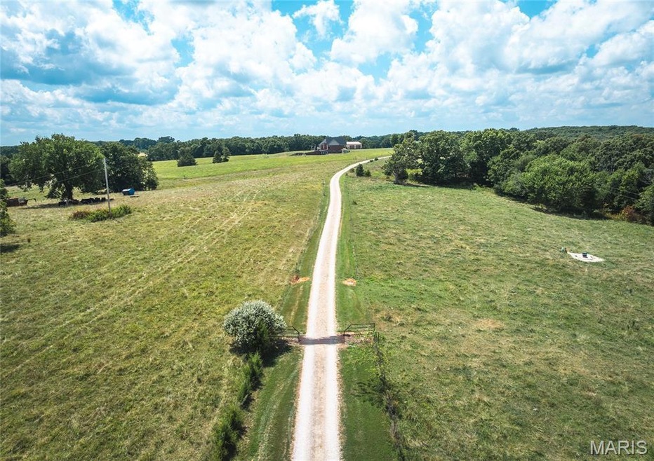 View from Hwy J of driveway and cattle guard