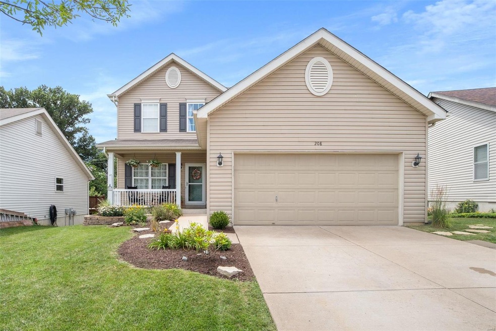 Beautiful curb appeal with maintenance free vinyl siding and covered porch.
