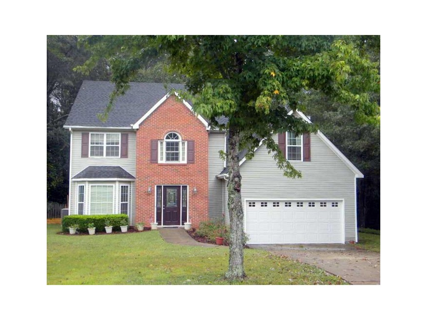 Exterior Front. Inviting brick accented 4 bedroom,