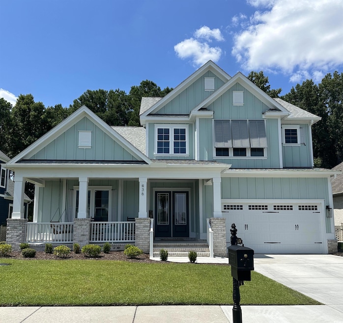 Craftsman inspired home featuring covered porch, a